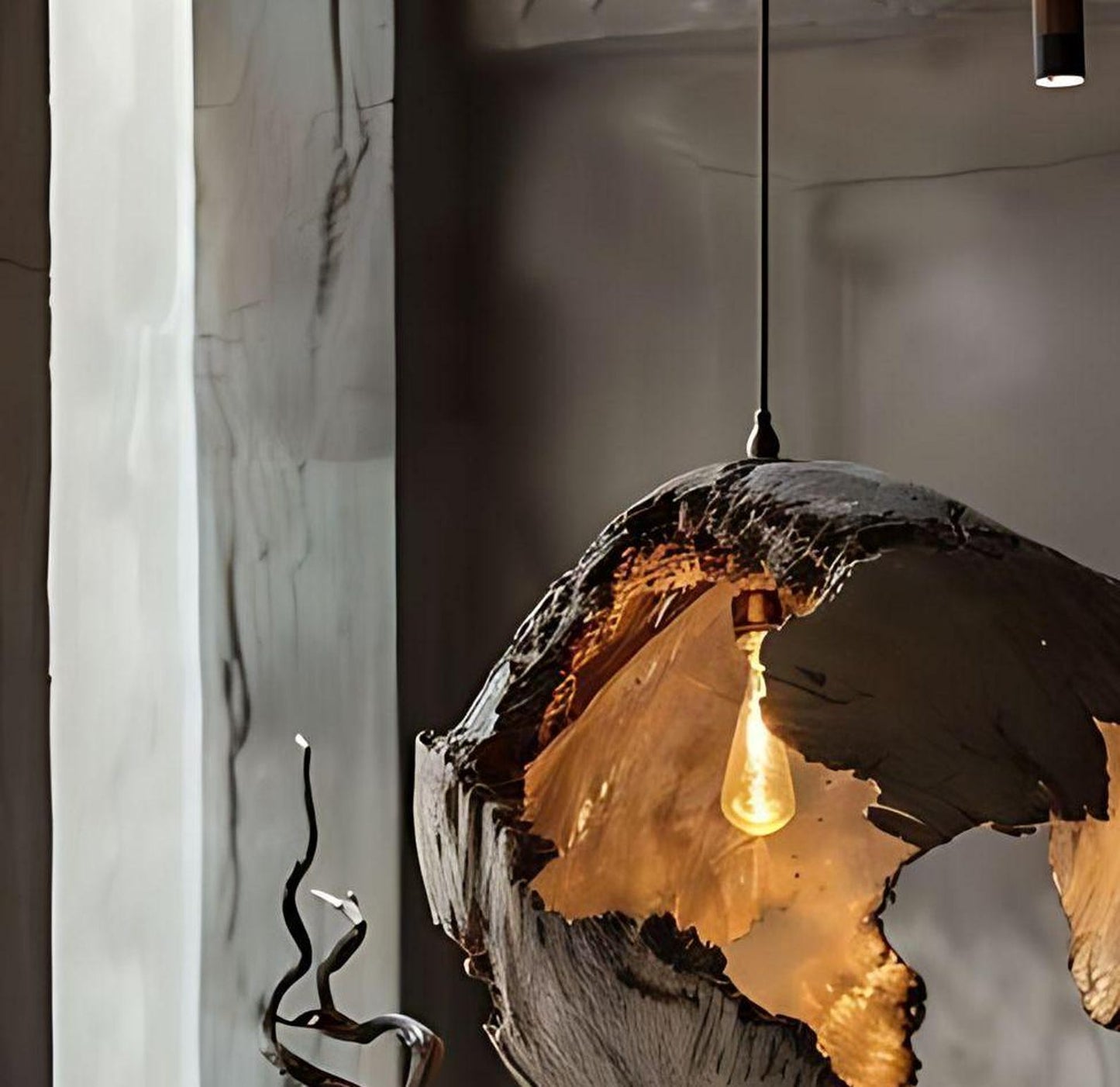 A handcrafted hanging ceiling lamp made from reclaimed driftwood with rough, natural texture, featuring exposed warm-tone Edison-style bulbs suspended by black cords designed to bring rustic coastal charm to living and dining spaces-2